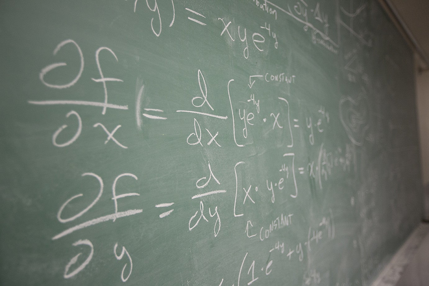 chalkboard with math equations written on it