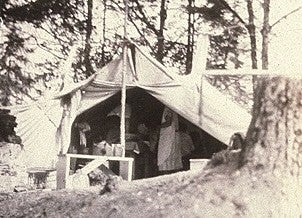 A historic photo of a tent on the Oregon Coast in the 1920s