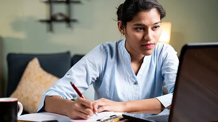 a student studies from a computer