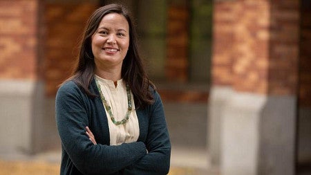 diana libuda, biology professor, posing in front of building