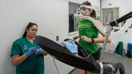 a person running on a treadmill wearing a mouth tube 