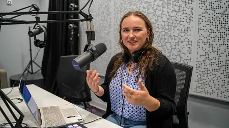 Student Erin Morrisson talking into a microphone