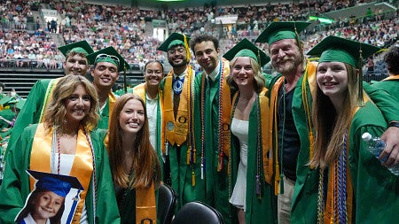 a group of people in cap and gowns