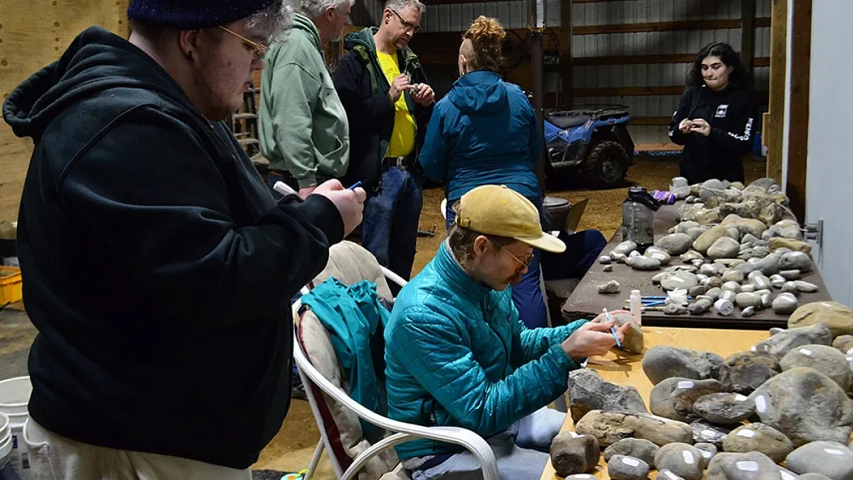 Students looking at rocks