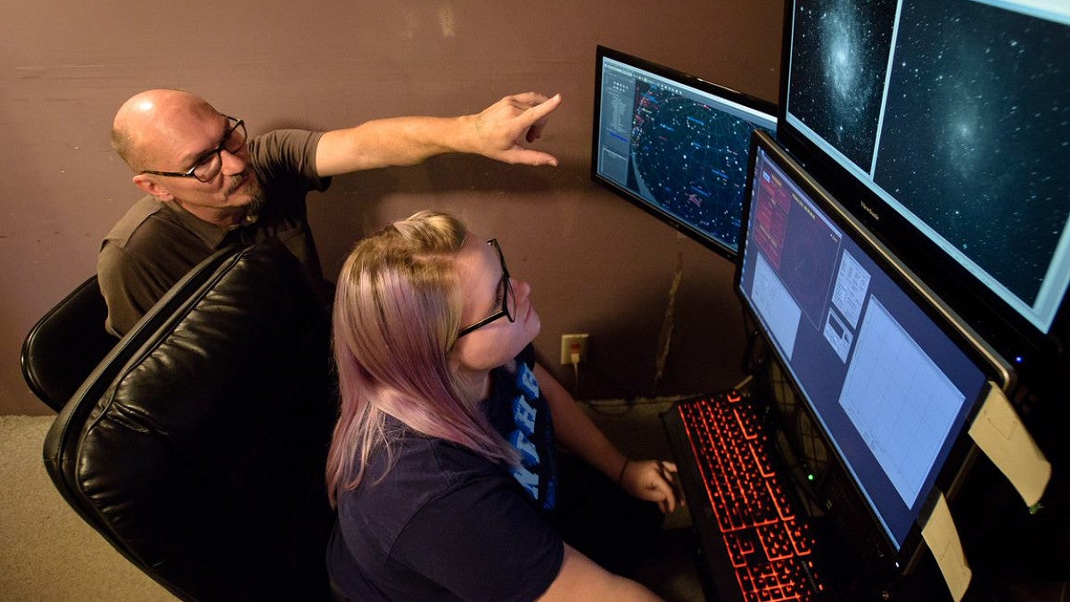 Teacher instructing student