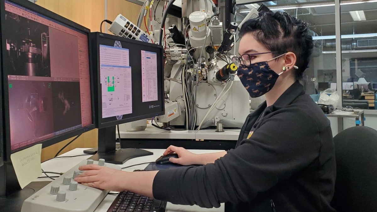 Student examining images on a computer