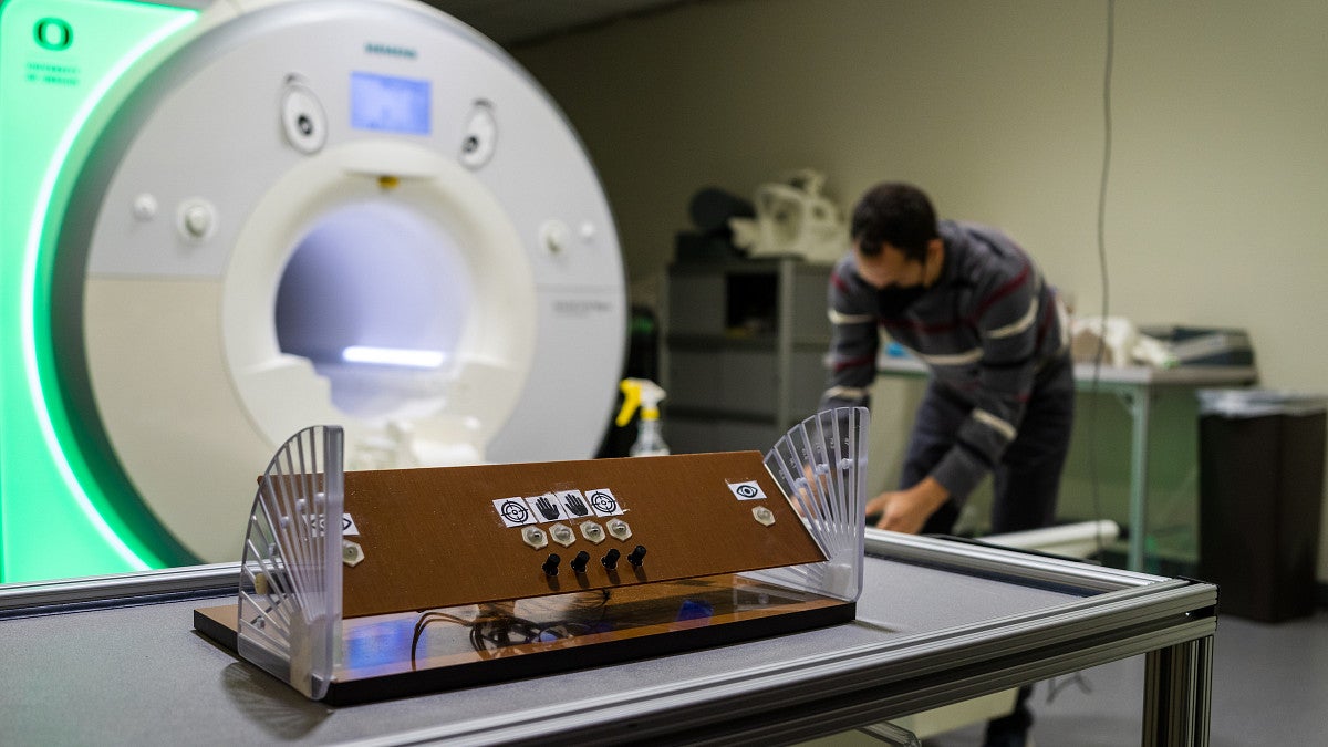 Lab technician working on an MRI machine