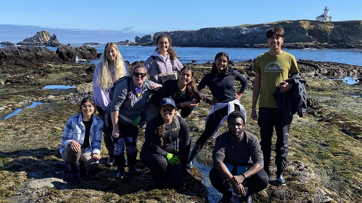 Group of students posing on the Oregon coast