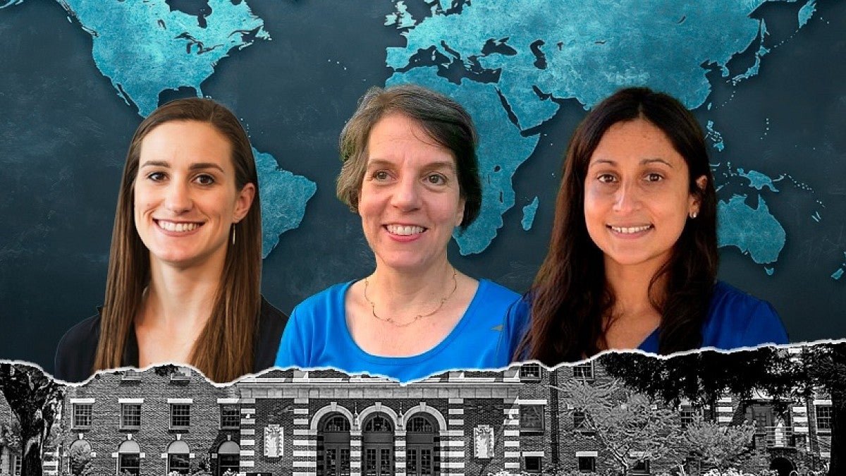 Three women with a global map in the background