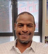Terence Campbell sitting at desk