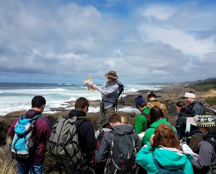A faculty member interacting with students in the field in Struble, Yachats