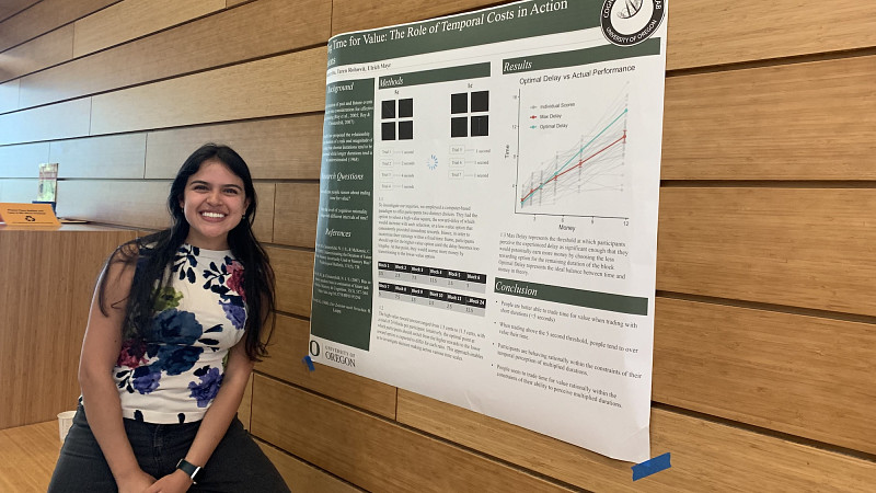 Psychololgy student presenting a research poster