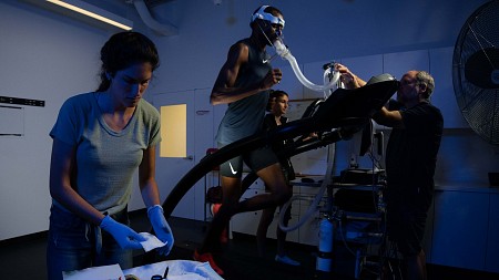 researchers collecting data on person jogging on treadmill
