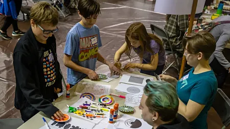 students working on STEM projects at a fair