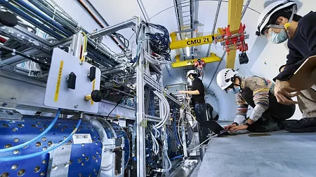 workers installing neutrino detector at cern collider
