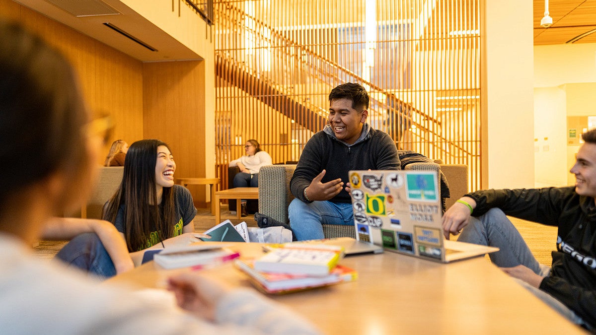 Students sitting in library studying