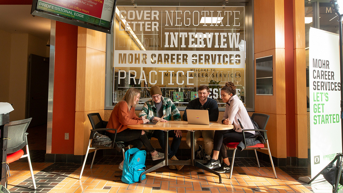 students sitting around table at UO's Career Center