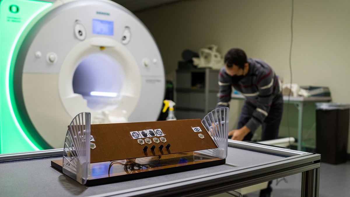 Lab technician working on an MRI machine