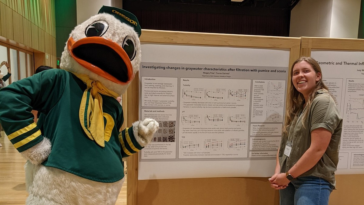 UO Ducks and Earth Science student at the exhibition